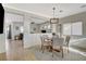 Cozy dining area featuring a round table, neutral decor, and an open layout to the other living spaces at 10988 Salernes St, Las Vegas, NV 89141
