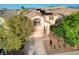Charming two-story home with a two car garage, landscaped front yard and mature shade trees at 10988 Salernes St, Las Vegas, NV 89141