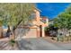 Charming two-story home with a two-car garage and desert landscaping in a Gathering-friendly neighborhood at 10988 Salernes St, Las Vegas, NV 89141