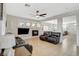 Bright living room features tile floors, a fireplace with a mantle, and comfortable seating at 10988 Salernes St, Las Vegas, NV 89141