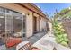 Private back patio area with seating, mature flowering tree, and block wall surround at 110 Huckleberry Ln, Henderson, NV 89074