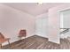 Bedroom featuring hardwood floors, closet, and staircase access at 110 Huckleberry Ln, Henderson, NV 89074