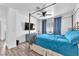 Bright bedroom with canopy bed, ceiling fan and wood-look floors at 110 Huckleberry Ln, Henderson, NV 89074