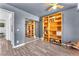 Bedroom features hardwood floors, ceiling fan, mirrored closet, and built in shelves at 110 Huckleberry Ln, Henderson, NV 89074