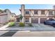 Charming townhome with a well-manicured front yard and an attached two-car garage at 110 Huckleberry Ln, Henderson, NV 89074