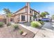 Charming townhome with a well-manicured front yard and driveway at 110 Huckleberry Ln, Henderson, NV 89074