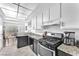 Well-lit kitchen with granite countertops and stainless steel appliances at 110 Huckleberry Ln, Henderson, NV 89074