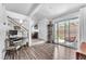 Open living area with wood floors and sliding glass doors to the patio at 110 Huckleberry Ln, Henderson, NV 89074