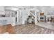 Spacious living room featuring wood floors and access to other home areas at 110 Huckleberry Ln, Henderson, NV 89074