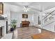Open living area with wood-look floors, piano and ample space at 110 Huckleberry Ln, Henderson, NV 89074