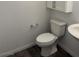 Clean bathroom featuring a modern toilet and sink, complemented by wood look floors at 12112 Polar White Ct # 3, Las Vegas, NV 89183