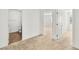 Open doorway from carpeted bedroom leading to a bathroom with wood-look floors at 12112 Polar White Ct # 3, Las Vegas, NV 89183