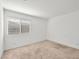 Bright carpeted bedroom with a window providing natural light at 12112 Polar White Ct # 3, Las Vegas, NV 89183