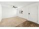Bedroom featuring a ceiling fan, carpet, and a large window at 12112 Polar White Ct # 3, Las Vegas, NV 89183