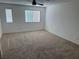 Generous bedroom with ceiling fan, soft carpeting, and lots of light at 12112 Polar White Ct # 3, Las Vegas, NV 89183