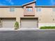 Townhome featuring a two-car garage and neutral stucco exterior at 12112 Polar White Ct # 3, Las Vegas, NV 89183