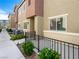 Contemporary townhouse exterior with neutral tones, walkway and garden, perfect for comfortable living at 12112 Polar White Ct # 3, Las Vegas, NV 89183