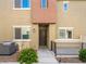 Exterior view of a townhome featuring a private entry and landscaping at 12112 Polar White Ct # 3, Las Vegas, NV 89183
