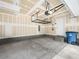 Spacious garage with concrete flooring, storage racks and utility access, ready for vehicles and projects at 12112 Polar White Ct # 3, Las Vegas, NV 89183