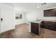 Kitchen featuring a stainless steel sink, hardwood floors, and granite countertops at 12112 Polar White Ct # 3, Las Vegas, NV 89183
