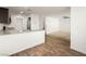 Open concept living room featuring hardwood floors and adjacent kitchen at 12112 Polar White Ct # 3, Las Vegas, NV 89183