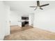 Carpeted living room featuring a ceiling fan, stairs and hardwood floors at 12112 Polar White Ct # 3, Las Vegas, NV 89183