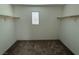 Spacious walk-in closet with ample shelving and natural light, ideal for organization at 12112 Polar White Ct # 3, Las Vegas, NV 89183