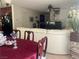 Inviting living room featuring a cozy white couch and dining table at 123 Gilliflower Ave, Las Vegas, NV 89183