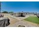 Large, fully fenced backyard featuring artificial turf, concrete, and a charming patio area, perfect for outdoor living at 1816 Silver Birch Ln, Las Vegas, NV 89104