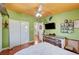 Bedroom featuring hardwood floors, closet, and a glimpse into the bathroom at 1816 Silver Birch Ln, Las Vegas, NV 89104