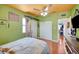 Bright bedroom featuring hardwood floors, closet, and a glimpse into the hallway at 1816 Silver Birch Ln, Las Vegas, NV 89104
