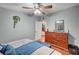 Comfortable bedroom with gray walls, dresser, and natural lighting at 1816 Silver Birch Ln, Las Vegas, NV 89104