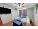 This bedroom features a large bed, natural light, and a closet at 1816 Silver Birch Ln, Las Vegas, NV 89104