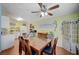 Bright dining area featuring hardwood floors, a wooden table with chairs, and charming decor at 1816 Silver Birch Ln, Las Vegas, NV 89104