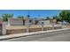 Welcoming single-story home with a secure fence, desert landscape, and a neatly kept front yard at 1816 Silver Birch Ln, Las Vegas, NV 89104