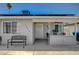 Cozy front porch with seating area, decorative welcome sign, and an inviting entrance at 1816 Silver Birch Ln, Las Vegas, NV 89104