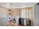 Functional laundry room with washer, dryer, water heater, and exterior access at 1816 Silver Birch Ln, Las Vegas, NV 89104