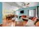 Open-concept living area with hardwood floors, ceiling fans, and a seamless flow at 1816 Silver Birch Ln, Las Vegas, NV 89104