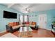 Comfortable living room featuring hardwood floors, ceiling fan, and stylish decor at 1816 Silver Birch Ln, Las Vegas, NV 89104