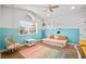 Bright bedroom showcasing a half-painted accent wall and a fun hanging egg chair at 2021 Summit Pointe Dr, Las Vegas, NV 89117