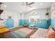 Bright bedroom showcasing a half-painted accent wall and a fun hanging egg chair at 2021 Summit Pointe Dr, Las Vegas, NV 89117