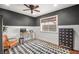 Inviting office space with stylish gray and white walls, modern furnishings, and a geometric rug at 2021 Summit Pointe Dr, Las Vegas, NV 89117
