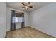Bedroom featuring tile floors, natural light and a ceiling fan at 2099 Port Royal Dr, Laughlin, NV 89029