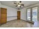 Bonus room featuring ample storage with tiled floors and bright french doors at 2099 Port Royal Dr, Laughlin, NV 89029