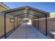 Extended metal carport connecting to the home for covered parking at 2099 Port Royal Dr, Laughlin, NV 89029