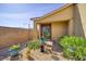 Side patio featuring decorative elements, low-maintenance landscape, and stone ground cover at 2099 Port Royal Dr, Laughlin, NV 89029