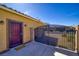 Side yard with metal gate, secure entrance, and low-maintenance landscape at 2099 Port Royal Dr, Laughlin, NV 89029