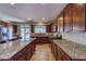 Well-equipped kitchen featuring granite countertops, an island with bar stools, and stainless steel appliances at 2099 Port Royal Dr, Laughlin, NV 89029