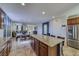 Open-concept kitchen with granite countertops, an island with bar seating, and stainless steel appliances at 2099 Port Royal Dr, Laughlin, NV 89029