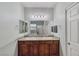 Bathroom vanity with double sinks, tile floors, and a large mirror at 2099 Port Royal Dr, Laughlin, NV 89029